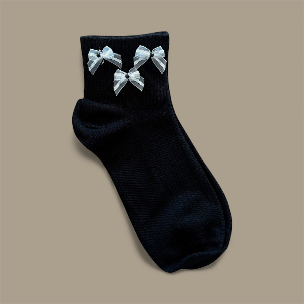 CALZINI NERI CON FIOCCO BIANCO